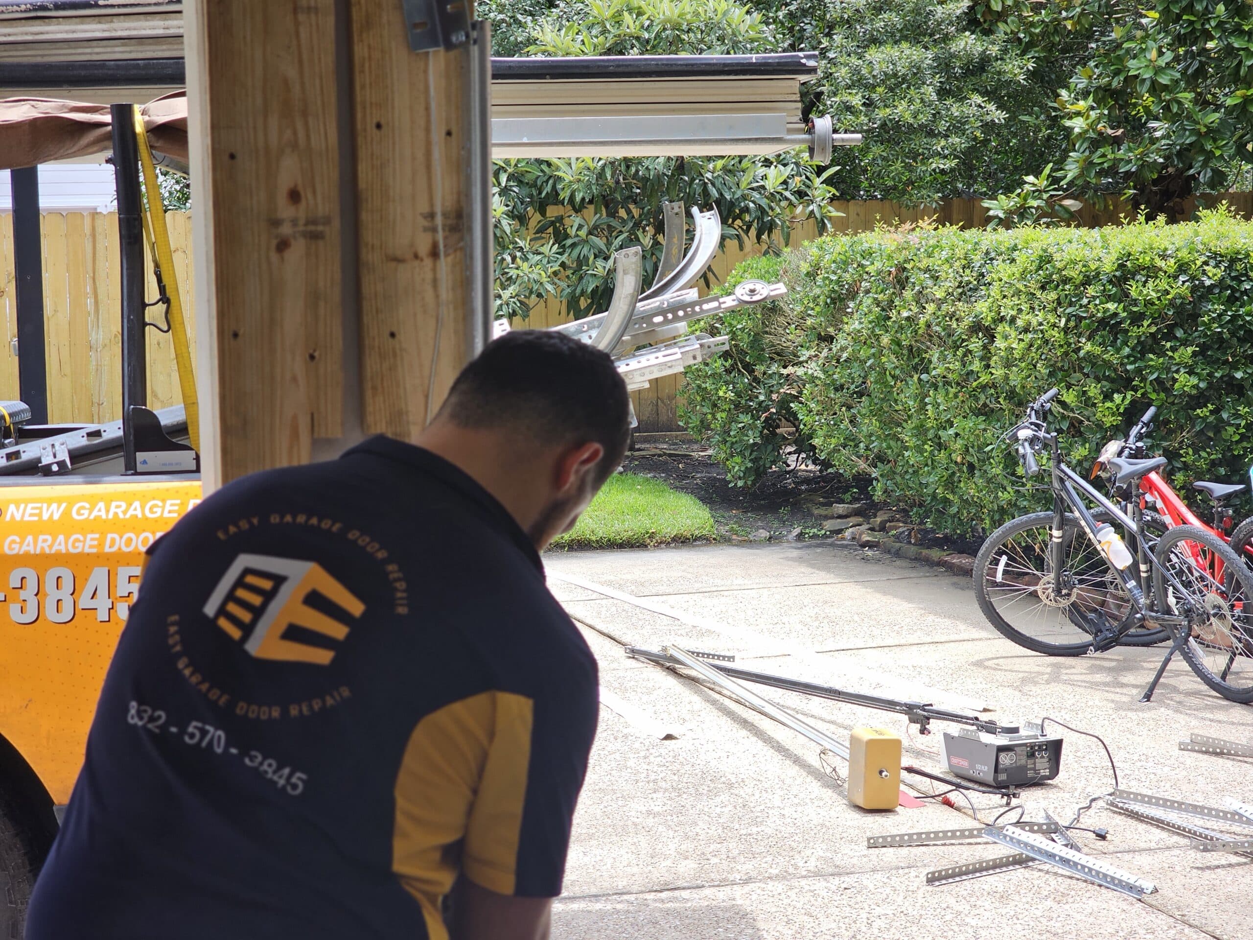 Sectional Garage Door Repair Services – Damaged Track and Opener Replacement on Green Tree Rd, Houston, TX